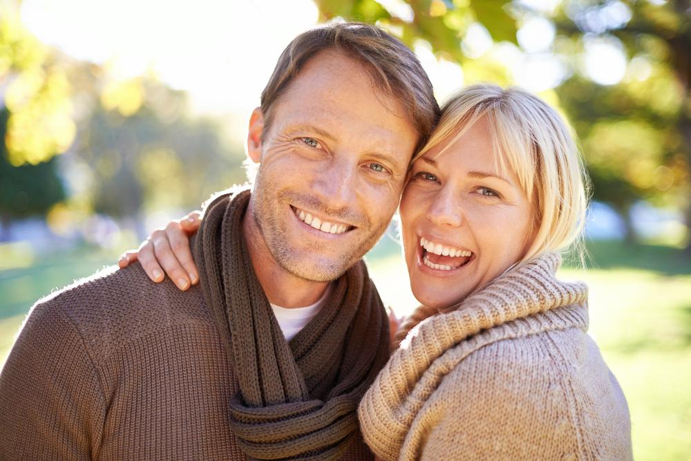 younger white couple hugging | cosmetic dentist bellevue tn