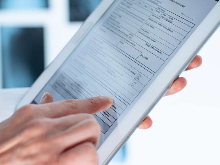 close up of ipad with digital records | poff dental associates